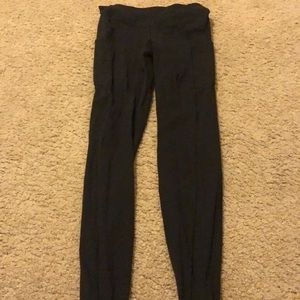 Lululemon black mid-waist leggings size 4